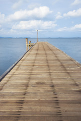 The wooden bridge extending into the sea. Khao Laem Ya National Park, Rayong, Thailand
