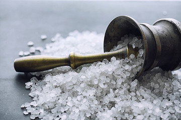 Large sea salt. Spice. Mortar and pestle for grinding.