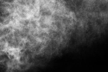 A stream of water and a cloud of drops