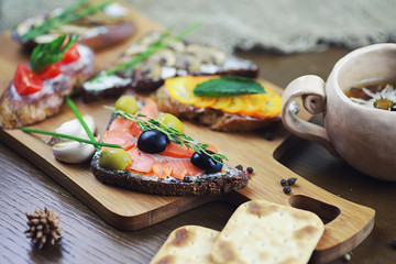 Assorted sandwiches with different fillings, fish mushrooms and others