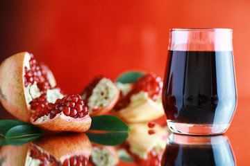 Ripe grains of pomegranate on the table. Pomegranate juice.