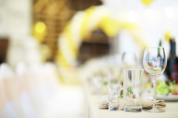 Glasses on the table in the restaurant. Table setting.