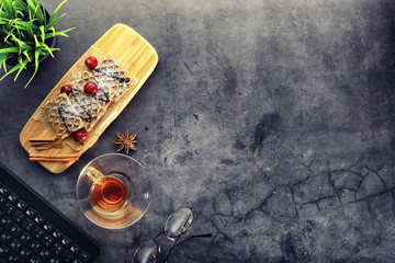 Sweet dessert with waffles and berries for tea at work.