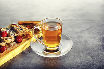 Sweet dessert with waffles and berries for tea at work.