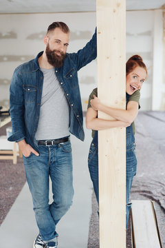 Happy laughing couple doing home improvements