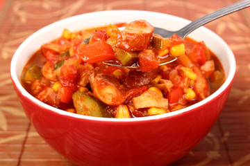 beef stew with vegetables and herbs in bowl