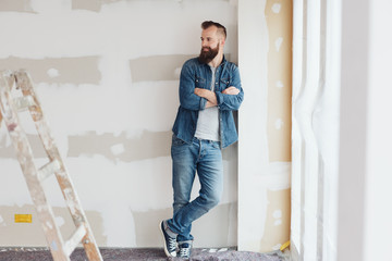 Young homeowner or builder on site in a new build