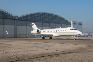 Business jet plane on the ground.
