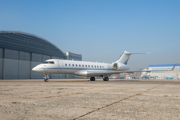 Business jet plane on the ground.