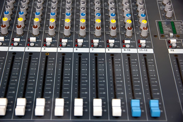 Audio sound mixer console. Music mixer control panel in a recording studio. Audio mixing console...