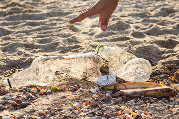 Garbage on the beach, waste picking concept