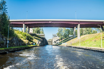 Lappeenranta, Finland - August 7, 2019: Lock and bridge on the Saimaa Canal at Malkia. View from water.