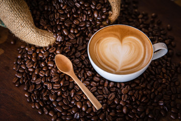 coffee latte with coffee beans  on dark background, top view