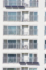 facade of white apartment building