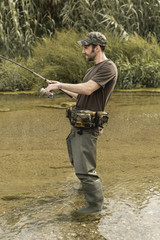 Fototapeta premium Man fishing at the river