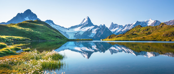 Sunrise view on Bernese range above Bachalpsee lake. Peaks Eiger, Jungfrau,Faulhorn in famous...