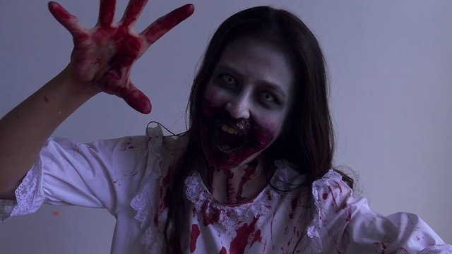 Female zombie,asian woman makeup to zombie in Halloween festival.