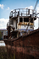 Old rusty ship on the shore