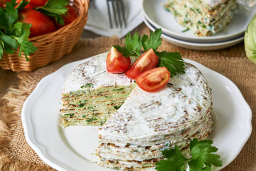 Zucchini cake with tomatoes and fresh parsley