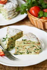 Zucchini cake with tomatoes and fresh parsley