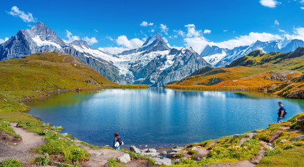 Fototapeta na wymiar Sunrise view on Bernese range above Bachalpsee lake. Peaks Eiger, Jungfrau,Faulhorn in famous location. Switzerland alps, Grindelwald valley