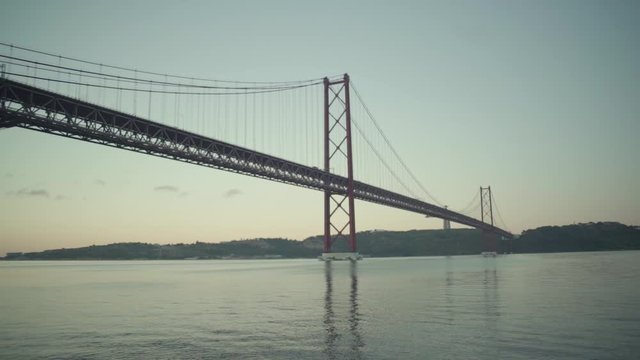 Lisbon Suspension bridge at dawn sunrise with river
