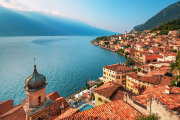 Naklejka na ściany i meble Scenic view on Lake Garda in Limone sul Garda town, famous tourist destination in Italy