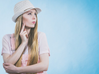 Cute teenage woman thinking