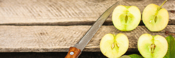 apple, fruits and petals (yellow and green variety of apples, cut into pieces slices). top food background. copy space