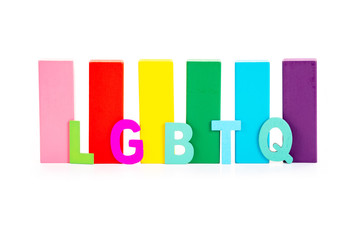 Alphabetic of LGBTQ and colorful wooden block on white background. Concept of LGBT activism.