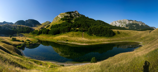 Fototapeta na wymiar Panoramic photo of Orlovacko lake, Zelengora mountain, Dinaric Alps, Bosnia and Herzegovina 