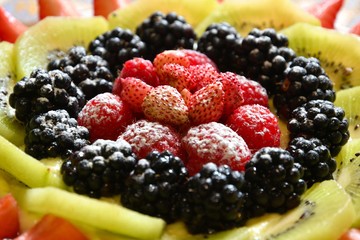 Close up on Fruit cake with Strawberries, Blackberries, Raspberries and Kiwi