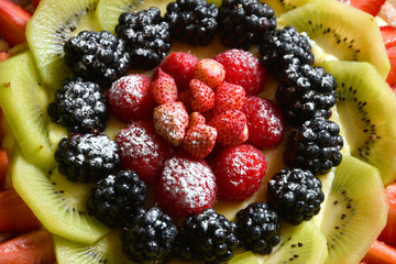 Close up on Fruit cake with Strawberries, Blackberries, Raspberries and Kiwi
