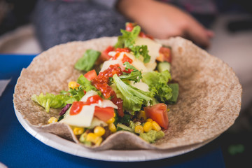 Taco tortilla healthy wrap with salad and sauce