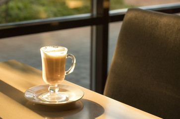 Morning coffee in a coffee shop with sunlight