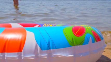 Summer scene. Tourists swim in the sea. 