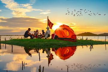 tourist camping enjoy camping on the small island in the lake at lowest tide of summer, camping...