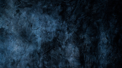 Naklejka premium Texture of black concrete wall, dark black background and blue light for graphic design