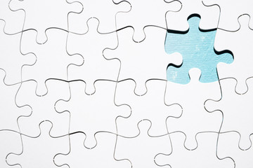 Piece missing from white jigsaw puzzle