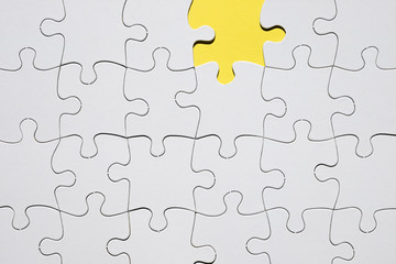 Fototapeta premium White jigsaw puzzle grid with missing puzzle piece