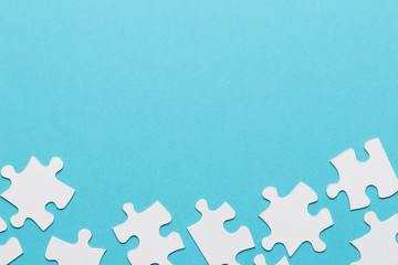 Separate jigsaw puzzle piece at the bottom of blue background