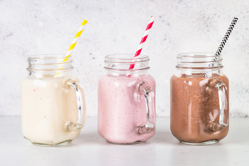 Banana, chocolate and strawberry milkshakes.