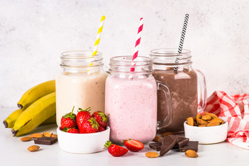 Banana, chocolate and strawberry milkshakes.