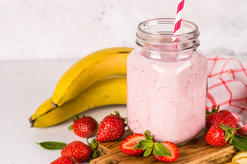 Strawberry milkshake or smoothie in mason jar.