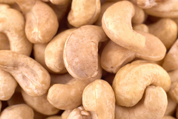 Fototapeta na wymiar Cashew nuts background texture, copy space, close up. Top view, flat lay