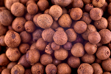 Allspice background texture, copy space, close up. Top view, flat lay