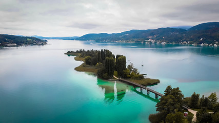 Aerial view of lake Worthersee in Portschach Am Worthersee town 