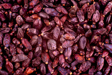 Dried barberry berries background texture, copy space, close up. Top view, flat lay