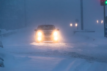 Bad weather traffic in snow storm. Sotkamo, Finland.