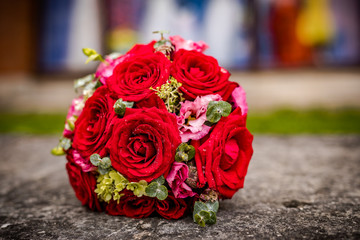 Beautiful bouquet of fresh flowers on a stone slab.